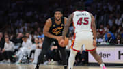 Apr 28, 2025; Miami, Florida, USA; Cleveland Cavaliers guard Donovan Mitchell (45) protects the basketball from Miami Heat guard Davion Mitchell (45) in the second quarter during game four for the first round of the 2025 NBA Playoffs at Kaseya Center. Mandatory Credit: Sam Navarro-Imagn Images