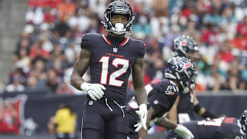 Dec 15, 2024; Houston, Texas, USA; Houston Texans wide receiver Nico Collins (12) gets ready for a play during the game against the Miami Dolphins at NRG Stadium. Mandatory Credit: Troy Taormina-Imagn Images