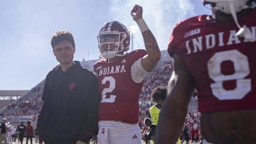 Oct 19, 2024; Bloomington, Indiana, USA; Indiana Hoosiers quarterback Tayven Jackson (2) walks with Indiana Hoosiers quarterback Kurtis Rourke (9) after beating the Nebraska Cornhuskers at Memorial Stadium. Mandatory Credit: Jacob Musselman-Imagn Images