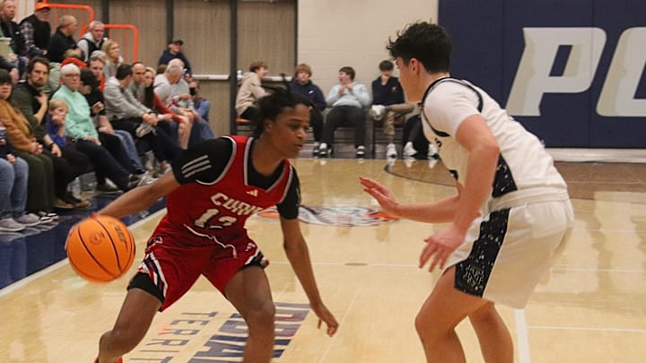 Justin Olover of Curie tries to make a move against New Trier in a quarterfinal game at the 93rd Pontiac Holiday Tournament. Justin Olover of Curie tries to make a move against New Trier in a quarterfinal game at the 93rd Pontiac Holiday Tournament.