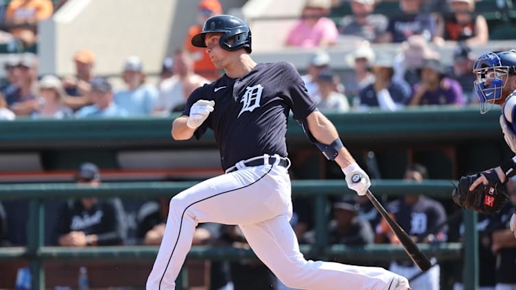 Mar 4, 2023; Lakeland, Florida, USA;  Detroit Tigers infielder Andre Lipcius (27) hits a RBI single