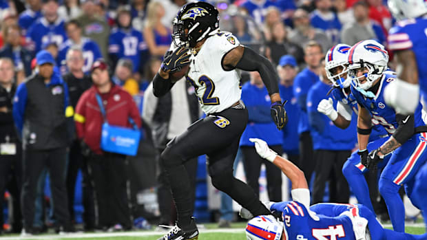 Baltimore Ravens running back Derrick Henry (22) runs with the ball for a touchdown against the Buffalo Bills during Week 1.