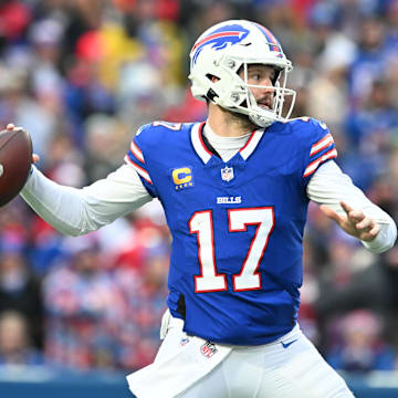 Dec 31, 2023; Orchard Park, New York, USA; Buffalo Bills quarterback Josh Allen (17) throws a pass in the second quarter against the New England Patriots at Highmark Stadium.