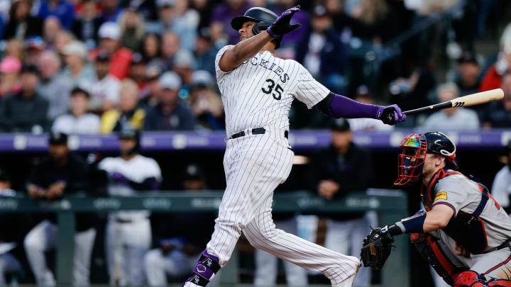 Aug 9, 2024; Denver, Colorado, USA; Colorado Rockies catcher Elias Diaz (35) hits an RBI double in the fourth inning against the Atlanta Braves at Coors Field. Mandatory Credit: Isaiah J. Downing-USA TODAY Sports