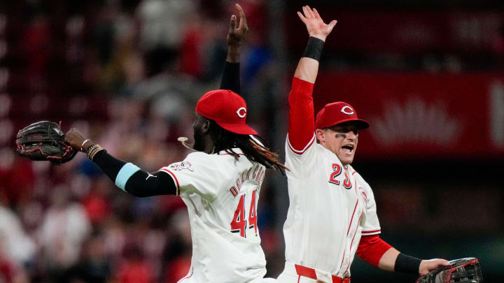 Cincinnati Reds shortstop Elly De La Cruz (44) and outfielder TJ Friedl (29) celebrate a win after the ninth inning of the MLB National League game between the Cincinnati Reds and the Chicago Cubs at Great American Ball Park in downtown Cincinnati on Tuesday, July 30, 2024. The Reds won 6-3.