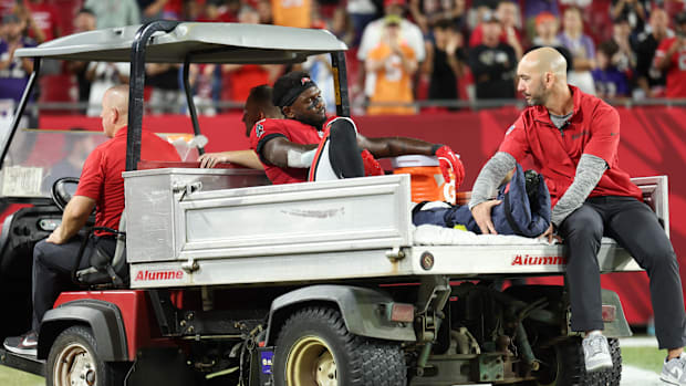 Tampa Bay Buccaneers wide receiver Chris Godwin (14) is carted off the field during a game against the Baltimore Ravens.