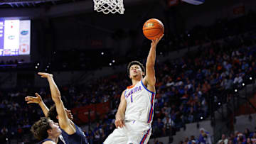 Dec 21, 2024; Gainesville, Florida, USA; Florida Gators guard Walter Clayton Jr. (1) attempts a layup against the North Florida Ospreys during the second half at Exactech Arena at the Stephen C. O'Connell Center. Mandatory Credit: Matt Pendleton-Imagn Images