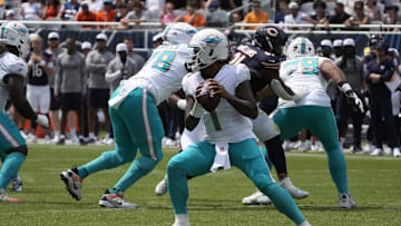 Aug 10, 2025; Chicago, Illinois, USA; Miami Dolphins quarterback Tua Tagovailoa (1) looks to pass the ball against the Chicago Bears during the first half at Soldier Field. 