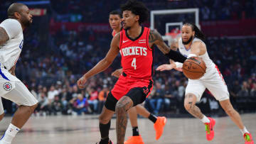 Apr 14, 2024; Los Angeles, California, USA; Houston Rockets guard Jalen Green (4) moves the ball against the Los Angeles Clippers during the first half at Crypto.com Arena. Mandatory Credit: Gary A. Vasquez-USA TODAY Sports