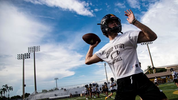 Carter Smith, the starting quarterback for the Bishop Verot High School, passes during a practice July 30, 2024.