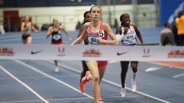 Natalie Dumas crosses the finish line to win the Girls 400m at the Dr. Norb Sander Invitational