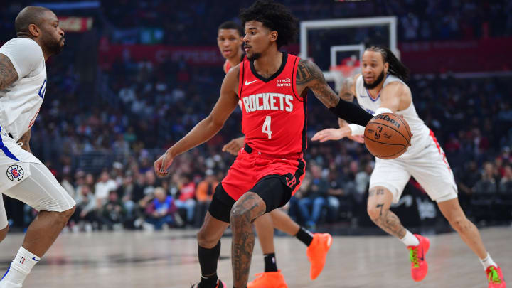 Apr 14, 2024; Los Angeles, California, USA; Houston Rockets guard Jalen Green (4) moves the ball against the Los Angeles Clippers during the first half at Crypto.com Arena. Mandatory Credit: Gary A. Vasquez-USA TODAY Sports