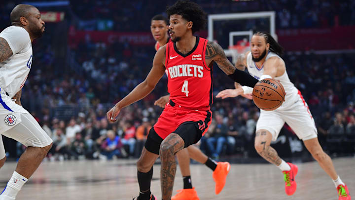 Apr 14, 2024; Los Angeles, California, USA; Houston Rockets guard Jalen Green (4) moves the ball against the Los Angeles Clippers during the first half at Crypto.com Arena. Mandatory Credit: Gary A. Vasquez-Imagn Images