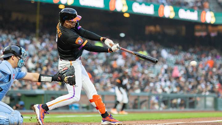 Jul 7, 2026; San Francisco, California, USA; San Francisco Giants shortstop Willy Adames (2) singles during the fourth inning against the Toronto Blue Jays at Oracle Park. Mandatory Credit: Bob Kupbens-Imagn Images