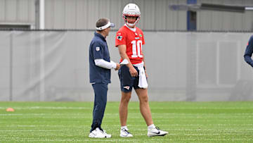 Jun 9, 2025; Foxborough, MA, USA; New England Patriots offensive coordinator Josh McDaniels works with quarterback Drake Maye (10) during minicamp at Gillette Stadium. Mandatory Credit: Eric Canha-Imagn Images