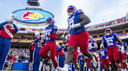 Nov 23, 2024; Kansas City, Missouri, USA;  The Kansas Jayhawks take the field agains the the Colorado Buffaloes at GEHA Field at Arrowhead Stadium. Mandatory Credit: Nick Tre. Smith-Imagn Images