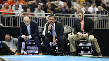 Mar 23, 2024; Kansas City, MO, USA; Virginia Tech head coach Tony Robie watches the 149 pound Virginia Tech Hokies wrestler Caleb Henson compete against Michigan Wolverines wrestler Austin Gomez.   Mandatory Credit: Reese Strickland-Imagn Images