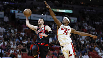 Apr 14, 2023; Miami, Florida, USA; Chicago Bulls guard Zach LaVine (8) drives to the basket ahead of Miami Heat forward Jimmy Butler (22) during the third quarter at Kaseya Center. Mandatory Credit: Sam Navarro-Imagn Images