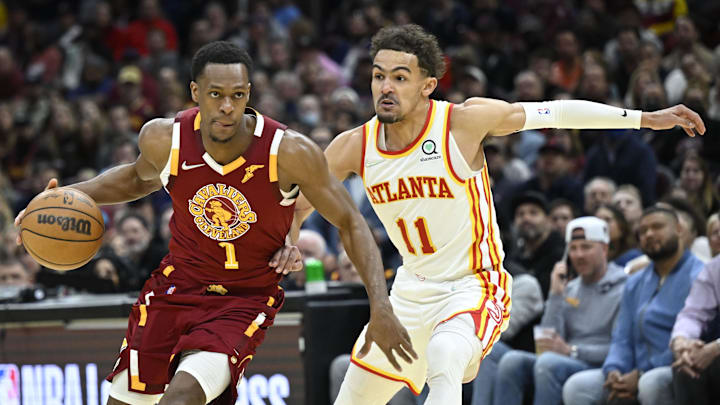 Apr 15, 2022; Cleveland, Ohio, USA; Atlanta Hawks guard Trae Young (11) defends Cleveland Cavaliers guard Rajon Rondo (1) in the third quarter at Rocket Mortgage FieldHouse. Mandatory Credit: David Richard-Imagn Images