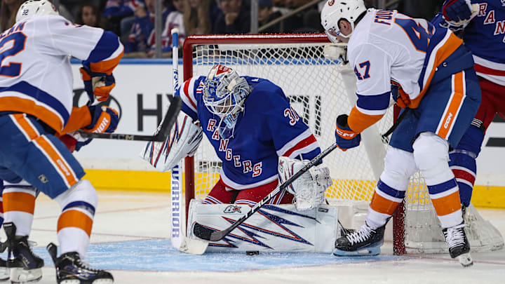 Sep 24, 2024; New York, New York, USA; New York Rangers goalie Igor Shesterkin (31) makes a save on New York Islanders forward Liam Foudy (47) during the second period at Madison Square Garden. Mandatory Credit: Danny Wild-Imagn Images