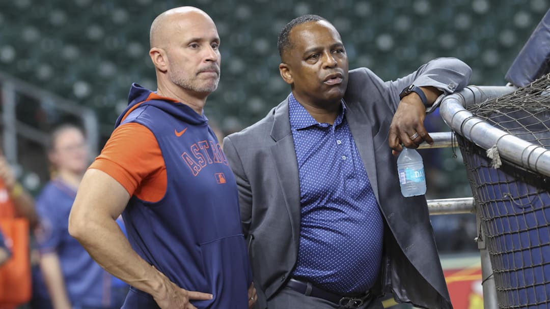 Jun 28, 2025; Houston, Texas, USA; Houston Astros manager Joe Espada (left) and general manager Dana Brown (right) talk on the field before the game against the Chicago Cubs at Daikin Park. Mandatory Credit: Troy Taormina-Imagn Images