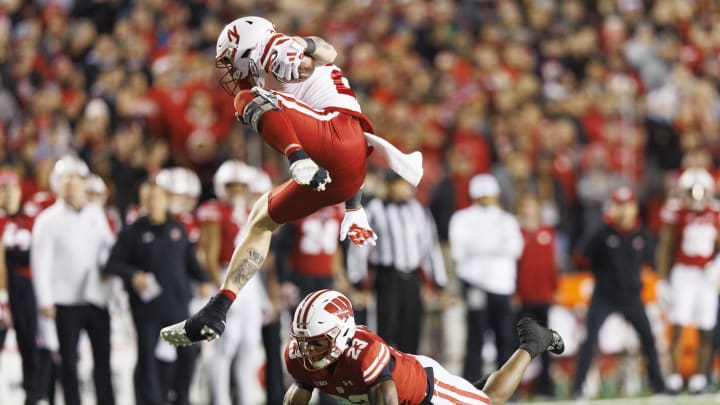 Nov 18, 2023; Madison, Wisconsin;  Nebraska tight end Thomas Fidone II is tackled by Wisconsin cornerback Jason Maitre. The Huskers' 24-17 overtime loss was part of a winless November that kept Nebraska one win shy of bowl eligibility.