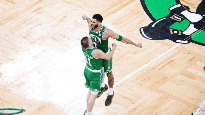 Jun 17, 2024; Boston, Massachusetts, USA; Boston Celtics guard Payton Pritchard (11) celebrates with forward Jayson Tatum (0) after a three point shot in the second quarter against the Dallas Mavericks during game five of the 2024 NBA Finals at TD Garden. Mandatory Credit: David Butler II-USA TODAY Sports