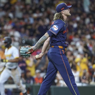 Jul 29, 2024; Houston, Texas, USA; Houston Astros relief pitcher Josh Hader (71) reacts and Pittsburgh Pirates center fielder Michael A. Taylor (18) rounds the bases after hitting a home run during the ninth inning at Minute Maid Park.