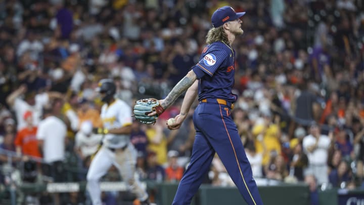 Jul 29, 2024; Houston, Texas, USA; Houston Astros relief pitcher Josh Hader (71) reacts and Pittsburgh Pirates center fielder Michael A. Taylor (18) rounds the bases after hitting a home run during the ninth inning at Minute Maid Park.