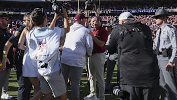 Nov 15, 2025; College Station, Texas, USA; Texas A&M Aggies head coach Mike Elko and South Carolina Gamecocks head coach Shane Beamer greet on the field after the game at Kyle Field. Mandatory Credit: Troy Taormina-Imagn Images