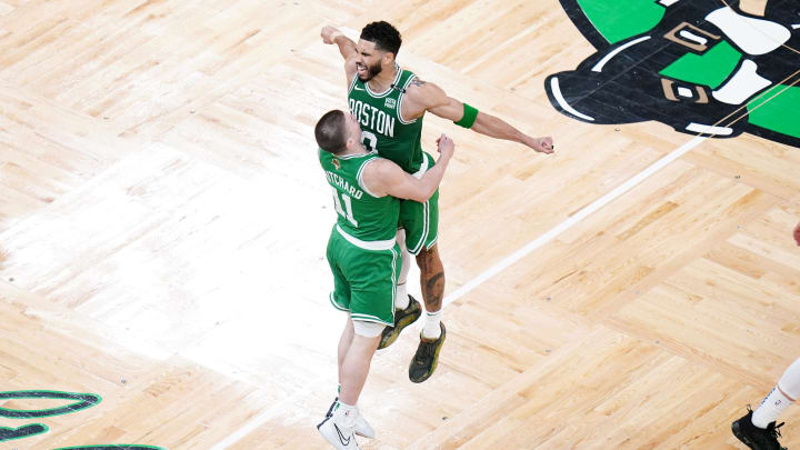 Jun 17, 2024; Boston, Massachusetts, USA; Boston Celtics guard Payton Pritchard (11) celebrates with forward Jayson Tatum (0) after a three point shot in the second quarter against the Dallas Mavericks during game five of the 2024 NBA Finals at TD Garden. Mandatory Credit: David Butler II-USA TODAY Sports