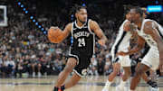 Oct 26, 2025; San Antonio, Texas, USA; Brooklyn Nets guard Cam Thomas (24) dribbles against San Antonio Spurs forward Harrison Barnes (40) in the first half at Frost Bank Center. Mandatory Credit: Daniel Dunn-Imagn Images
