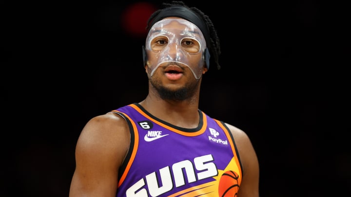 Jan 21, 2023; Phoenix, Arizona, USA; Phoenix Suns forward Josh Okogie wears a face mask against the Indiana Pacers in the first half at Footprint Center. Mandatory Credit: Mark J. Rebilas-USA TODAY Sports