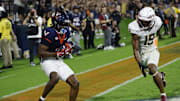 Sep 26, 2025; Charlottesville, Virginia, USA; Virginia Cavaliers wide receiver Trell Harris (11) catches a two point conversion as Florida State Seminoles defensive back Jerry Wilson (19) defends in the second overtime period at Scott Stadium. Mandatory Credit: Geoff Burke-Imagn Images