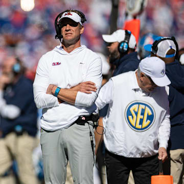 Nov 23, 2024; Gainesville, Florida, USA; Mississippi Rebels head coach Lane Kiffin looks on against the Florida Gators during the first half at Ben Hill Griffin Stadium. Mandatory Credit: Matt Pendleton-Imagn Images
