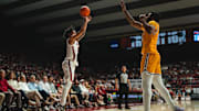 Dec 22, 2024; Tuscaloosa, Alabama, USA; Alabama Crimson Tide guard Houston Mallette (95) shoots from the three point line against Kent State Golden Flashes center Cli'Ron Hornbeak (42) during the second half at Coleman Coliseum. Mandatory Credit: Will McLelland-Imagn Images
