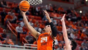 Oklahoma State Cowboys forward Patrick Suemnick (24) goes past Green Bay Phoenix forward Marcus Hall (13) during a college basketball game between the Oklahoma State Cowboys (OSU) and the Green Bay Phoenix at Gallagher-Iba Arena in Stillwater, Okla., Monday, Nov. 4, 2024.