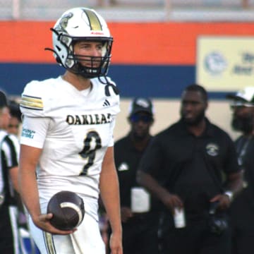 Oakleaf quarterback Jack McKissock (9) prepares to pass in warm-ups before a high school football game at Bolles on September 20, 2024. [Clayton Freeman/Florida Times-Union]
