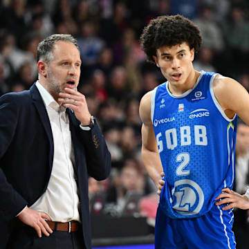 [US, Mexico & Canada customers only] Feb 15, 2025 Caen, FRANCE; St Quentin point guard Nolan Traore with coach Julien Mahe against Le Mans in a Leaders Cup match. Mandatory Credit: Franck Faugere/Presse Sports via Imagn Images