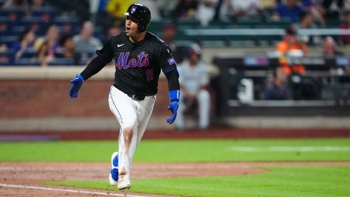 Jul 10, 2024; New York City, New York, USA; New York Mets second baseman Jose Iglesias (11) reacts to hitting a RBI single against the Washington Nationals during the sixth inning at Citi Field. Mandatory Credit: Gregory Fisher-USA TODAY Sports