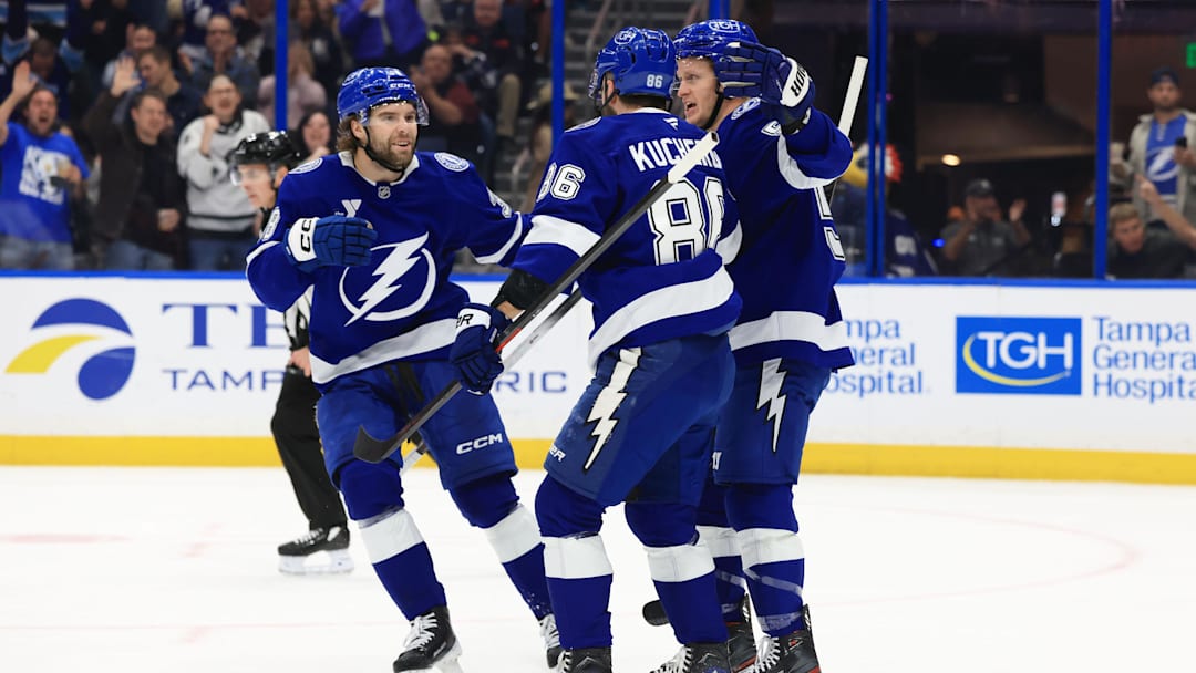 Feb 3, 2026; Tampa, Florida, USA; Tampa Bay Lightning right wing Nikita Kucherov (86) is congratulated by left wing Brandon Hagel (38) and center Jake Guentzel (59)  after he scored a goal against the Buffalo Sabres during the first period at Benchmark International Arena. Mandatory Credit: Kim Klement Neitzel-Imagn Images