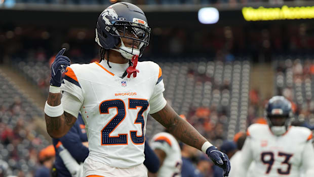 Denver Broncos cornerback Jahdae Barron (23) warms up before a game against the Houston Texans at NRG Stadium. 