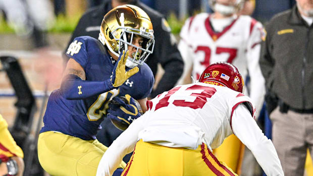 Xavier Watts intercepts a pass against USC in 2023 rivalry gam