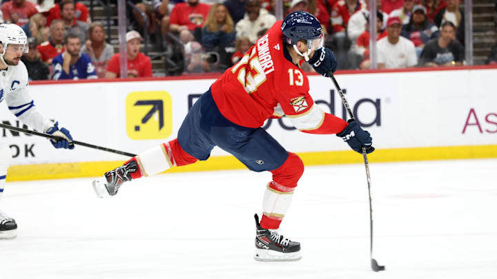 May 11, 2025; Sunrise, Florida, USA; Florida Panthers center Sam Reinhart (13) passes the puck against the Toronto Maple Leafs during the second period in game four of the second round of the 2025 Stanley Cup Playoffs at Amerant Bank Arena. Mandatory Credit: Kim Klement Neitzel-Imagn Images
