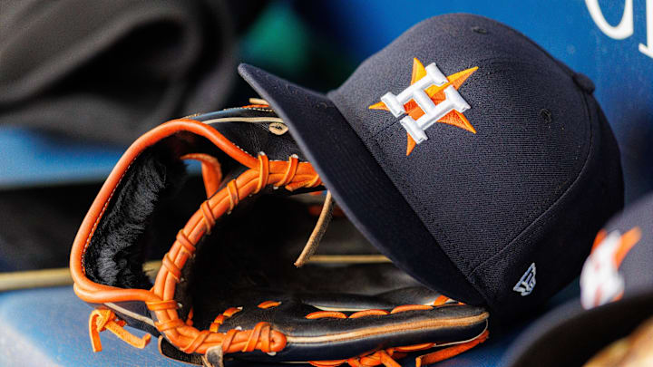 Apr 27, 2025; Kansas City, Missouri, USA; Houston Astros hat and glove in the dugout during the second inning against the Kansas City Royals at Kauffman Stadium. Apr 27, 2025; Kansas City, Missouri, USA; Houston Astros hat and glove in the dugout during the second inning against the Kansas City Royals at Kauffman Stadium.