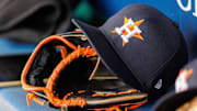 Apr 27, 2025; Kansas City, Missouri, USA; Houston Astros hat and glove in the dugout during the second inning against the Kansas City Royals at Kauffman Stadium. 