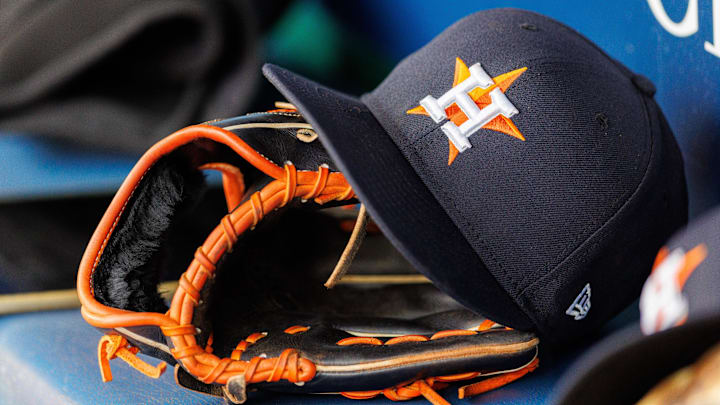 Apr 27, 2025; Kansas City, Missouri, USA; Houston Astros hat and glove in the dugout during the second inning against the Kansas City Royals at Kauffman Stadium. Apr 27, 2025; Kansas City, Missouri, USA; Houston Astros hat and glove in the dugout during the second inning against the Kansas City Royals at Kauffman Stadium.