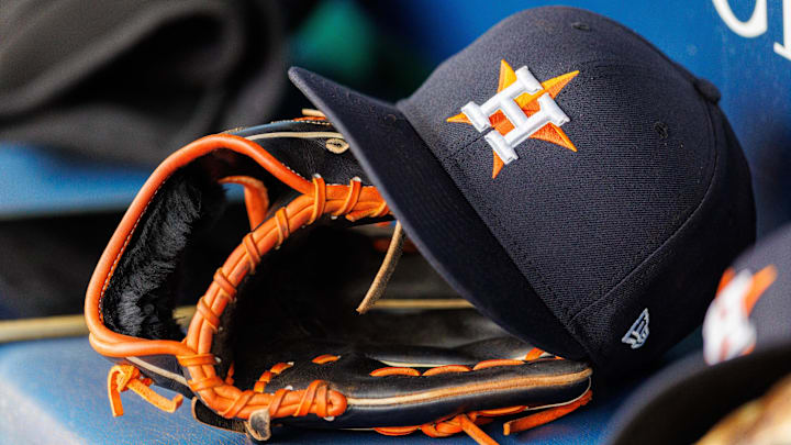 Apr 27, 2025; Kansas City, Missouri, USA; Houston Astros hat and glove in the dugout during the second inning against the Kansas City Royals at Kauffman Stadium. Apr 27, 2025; Kansas City, Missouri, USA; Houston Astros hat and glove in the dugout during the second inning against the Kansas City Royals at Kauffman Stadium.