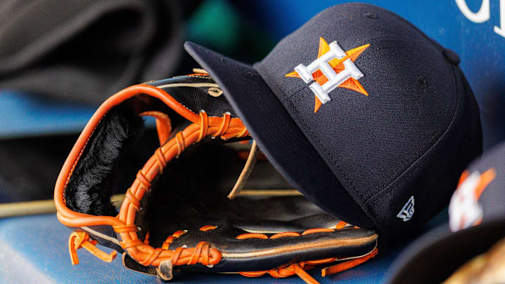 Apr 27, 2025; Kansas City, Missouri, USA; Houston Astros hat and glove in the dugout during the second inning against the Kansas City Royals at Kauffman Stadium. Apr 27, 2025; Kansas City, Missouri, USA; Houston Astros hat and glove in the dugout during the second inning against the Kansas City Royals at Kauffman Stadium.