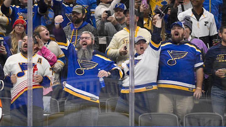 Oct 23, 2025; St. Louis, Missouri, USA; St. Louis Blues fans react after St. Louis Blues center Pius Suter (not pictured) scored against the Utah Mammoth during the second period at Enterprise Center. Mandatory Credit: Jeff Curry-Imagn Images